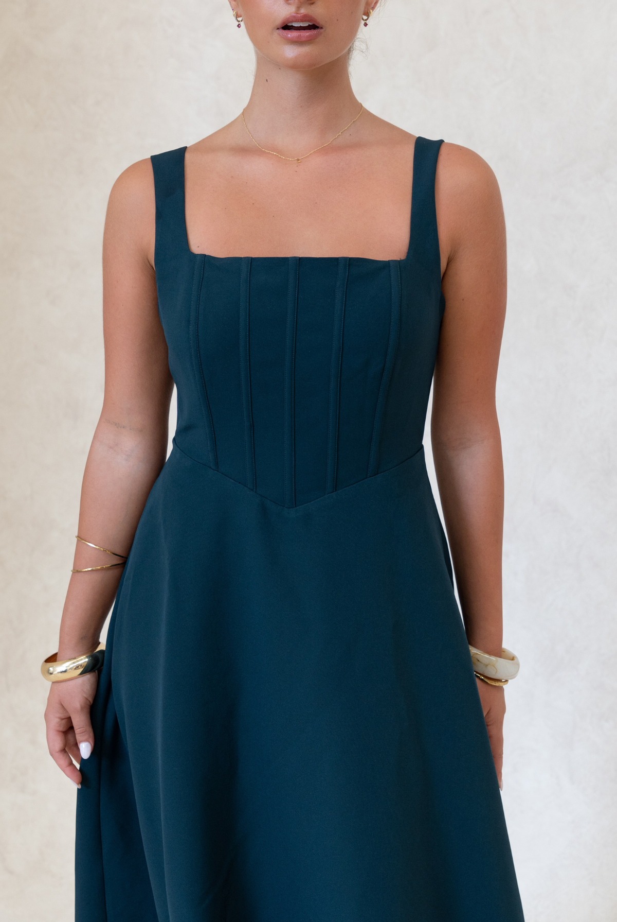 Danielle Dress Green – green fit and flare midi dress for weddings and events, side view