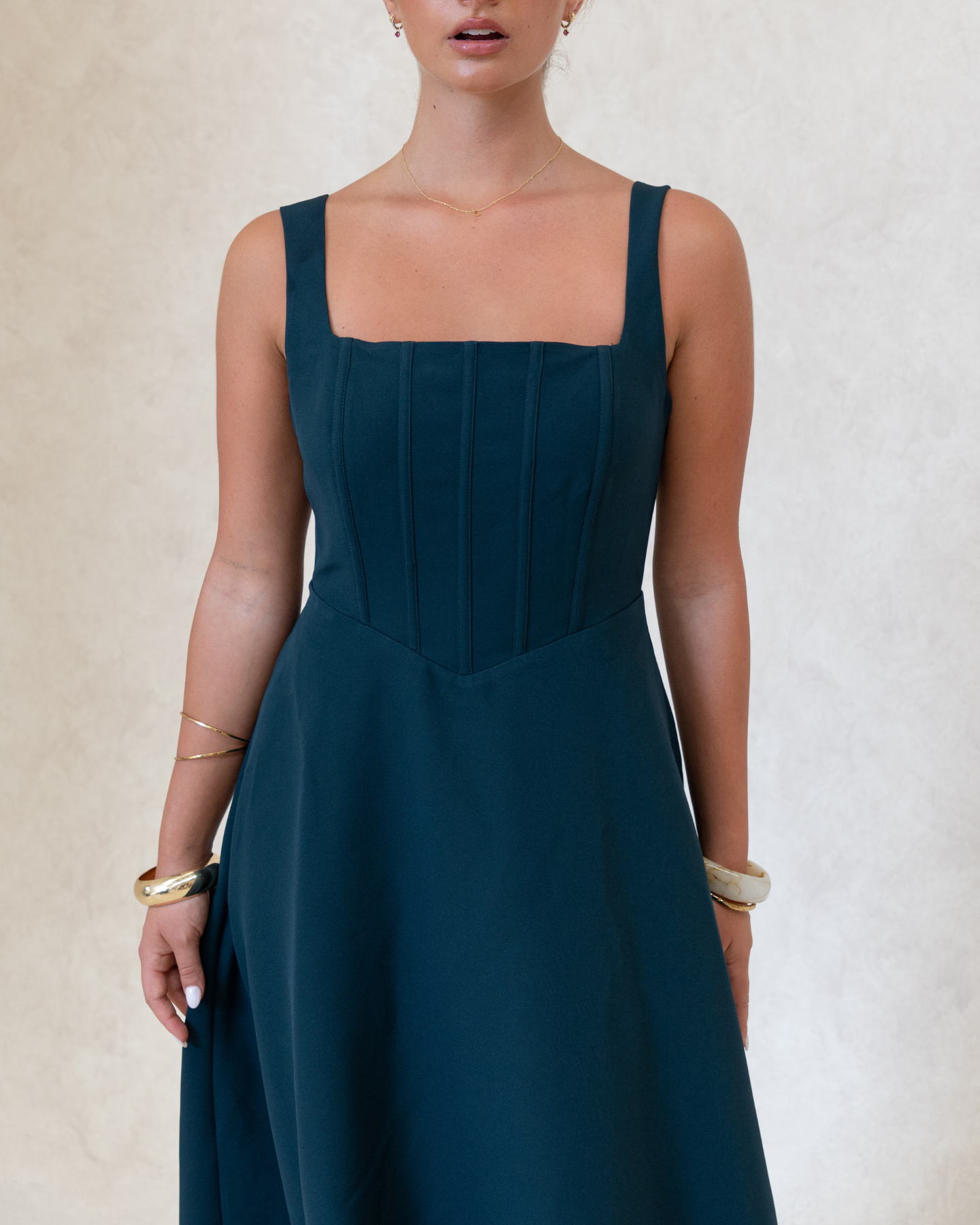Danielle Dress Green – green fit and flare midi dress for weddings and events, side view